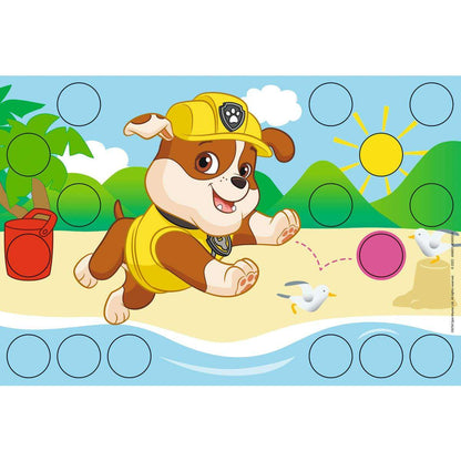 PAW Patrol Rubble on a beach activity mat, wearing a yellow hard hat, surrounded by placement circles