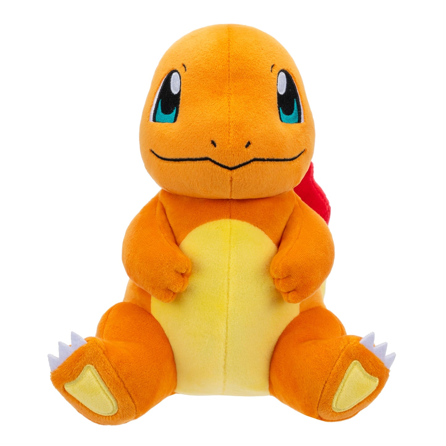Studio shot of an adorable sitting Charmander plush toy with soft orange fur, a yellow tummy, and large blue embroidered eyes