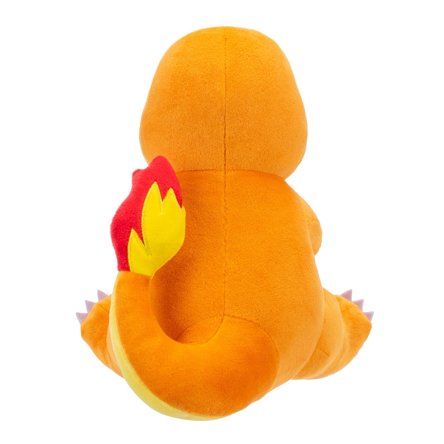 An isolated product view showing the back of the orange Pokemon Charmander plush toy highlighting its curled tail with a bright red and yellow flame tip