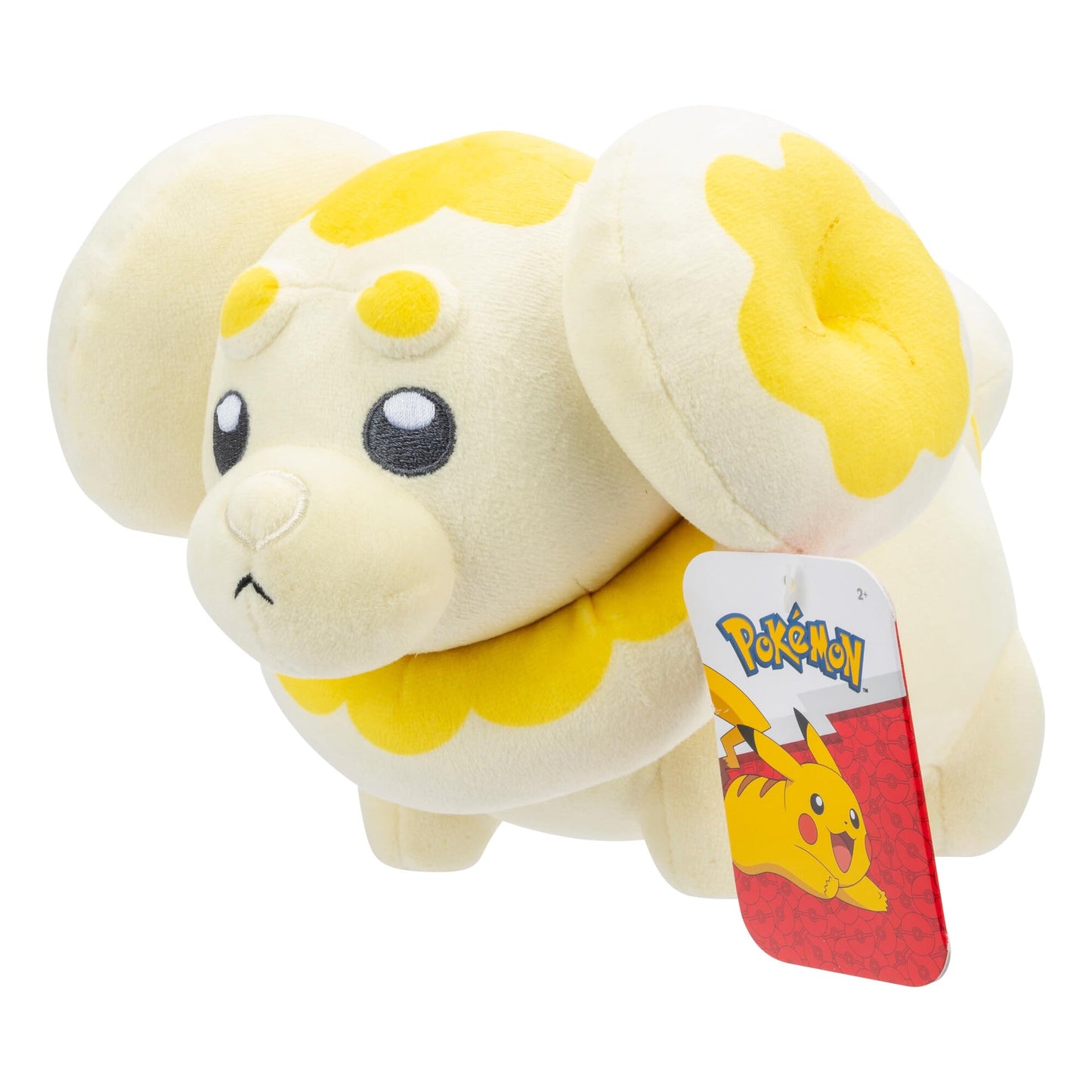 Close-up of a soft cream-colored Pokemon Fidough plush toy featuring bright yellow dough-like details on its head and ears, with a prominent red and white Pikachu hang tag attached