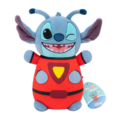 Disney Stitch Hug Mees plush in a red superhero suit with a yellow emblem, winking and smiling widely with tag