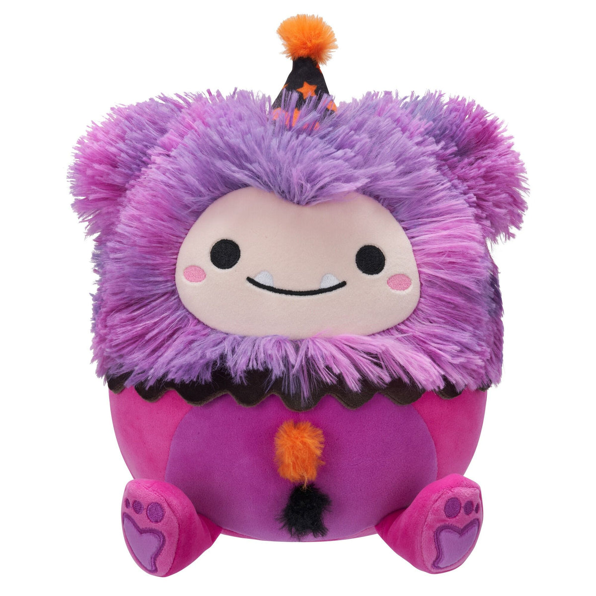 A purple and pink furry monster plush toy wearing a black and orange party hat, with a beige face, fangs, and a fluffy tail
