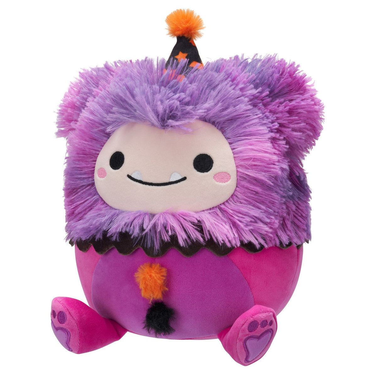 A purple and pink Squishmallow monster plush with shaggy fur, fangs, a party hat, and paw print feet