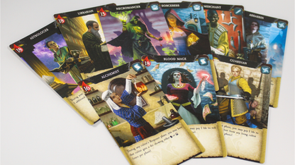 Colorful fantasy game character cards with detailed illustrations, like Alchemist and Necromancer, on a white surface