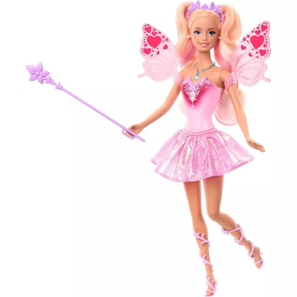 A Barbie doll with blonde hair and pink highlights wears a shimmery pink fairy dress, heart-adorned wings, a purple tiara, and holds a matching wand