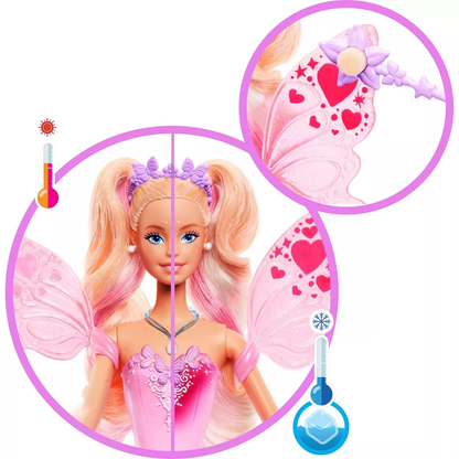 A Barbie fairy doll with blonde and pink hair wears a pink dress and wings that color-change with temperature, revealing heart patterns and glitter along with a purple wand accessory