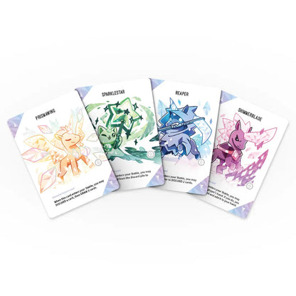 Four Unstable Unicorns Diamond Edition cards featuring unique characters Prismawing Sparklestar Reaper and Shimmerblade with crystalline artwork fanned on white