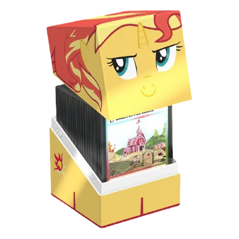 A yellow My Little Pony Squaroe card box with a red and yellow pony character&#39;s face on the lid, open to reveal many trading cards inside