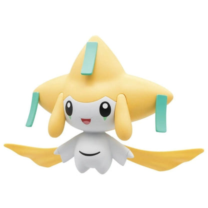 Jirachi Pokemon figure, white and yellow star-shaped toy with teal accents, smiling, against a white background