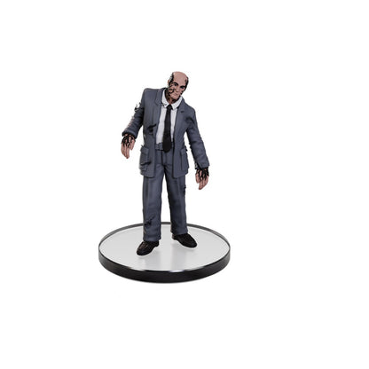 Collectible figure of a scarred man in a tattered gray suit, covered in dark tendrils, standing on a round base