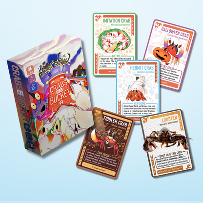 Crabs in a Bucket board game box is displayed with multiple colorful game cards featuring various crab species