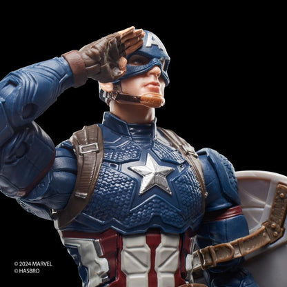 A Captain America action figure, in his blue, red, and white suit with a chest star, salutes with his gloved hand