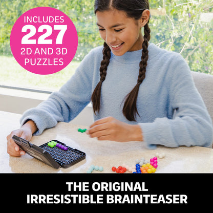 Kanoodle puzzle game box and open black case filled with multicoloured, interlocking spherical pieces