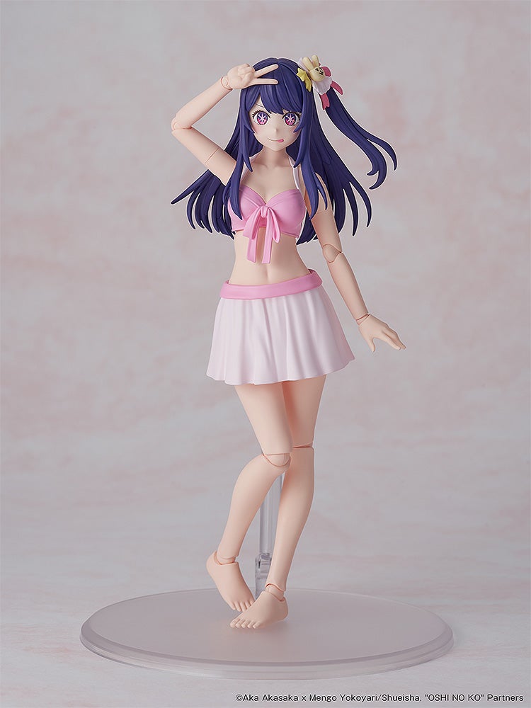 Purple-haired articulated anime figure in pink bikini top and white skirt, making a peace sign