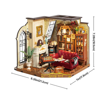 Assembled miniature Catherines living room diorama featuring a red sofa, fireplace, and full bookshelf