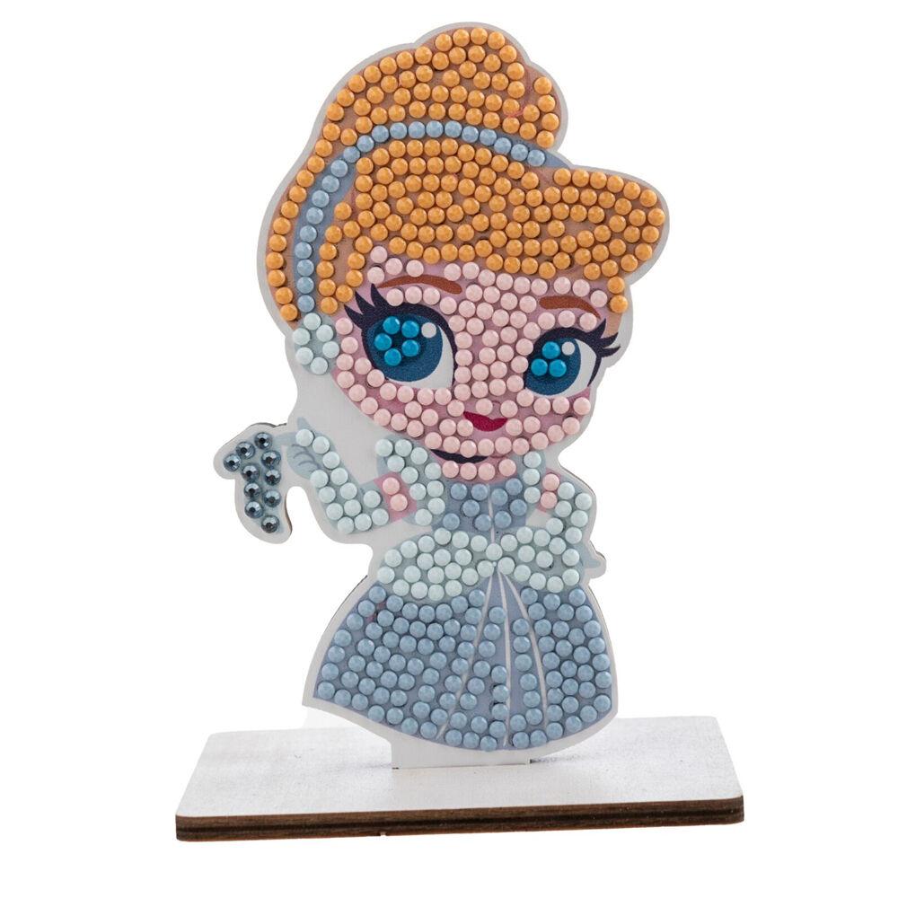 Diamond painting princess figurine in a blue dress, created from colorful beads and mounted on a wooden stand