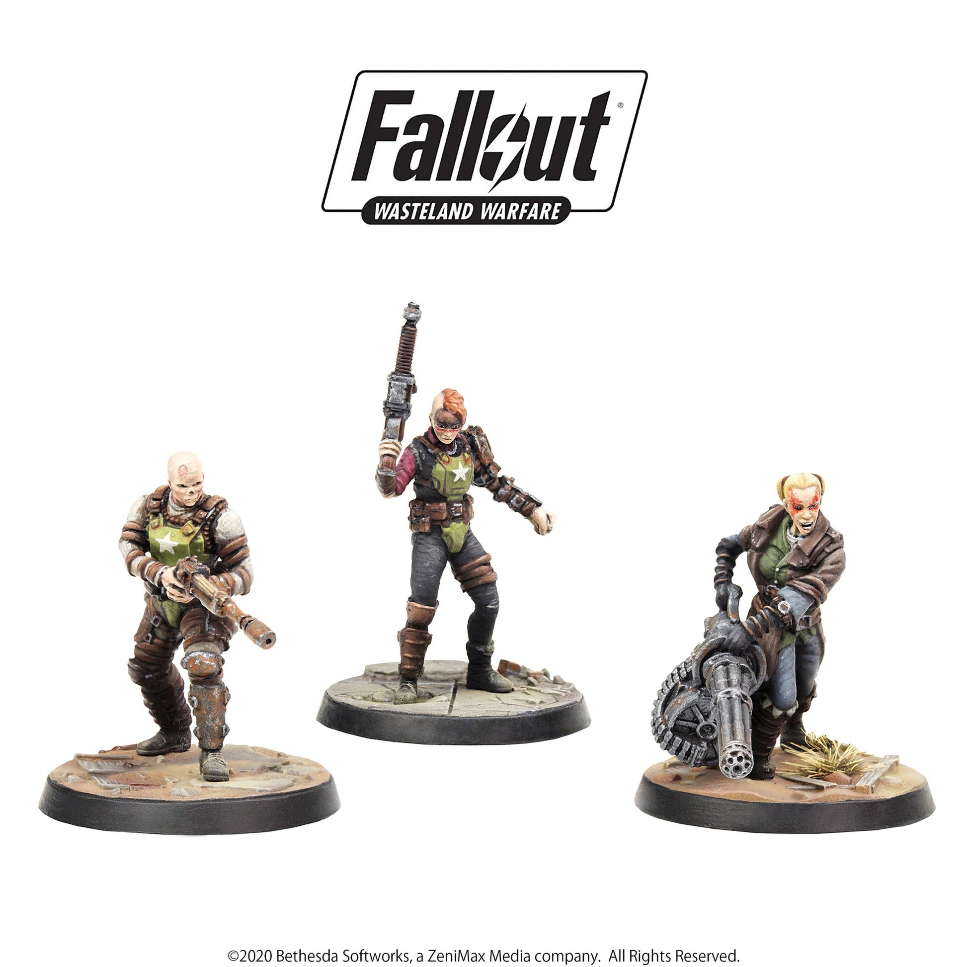 Three miniatures: a bald man with a rifle, a woman with a mohawk holding a weapon, and a woman firing a gatling gun