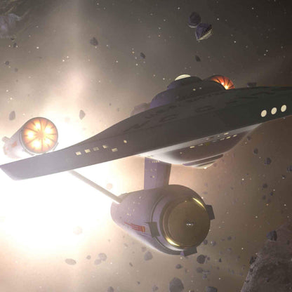 The Starship Enterprise with bright, glowing engines maneuvers through a field of space debris