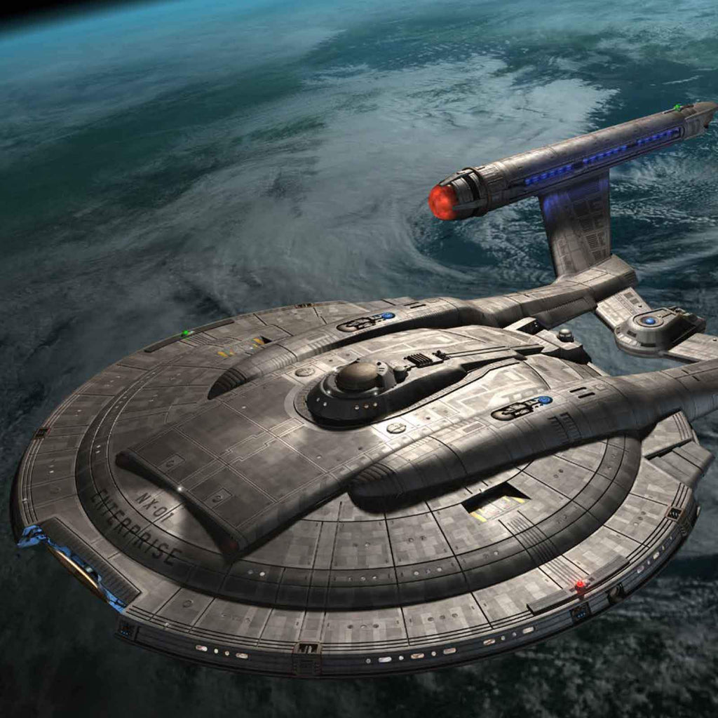 Starship Enterprise NX-01, a grey saucer-shaped vessel, orbits a cloud-covered blue planet