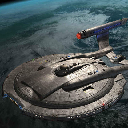 Starship Enterprise NX-01, a grey saucer-shaped vessel, orbits a cloud-covered blue planet