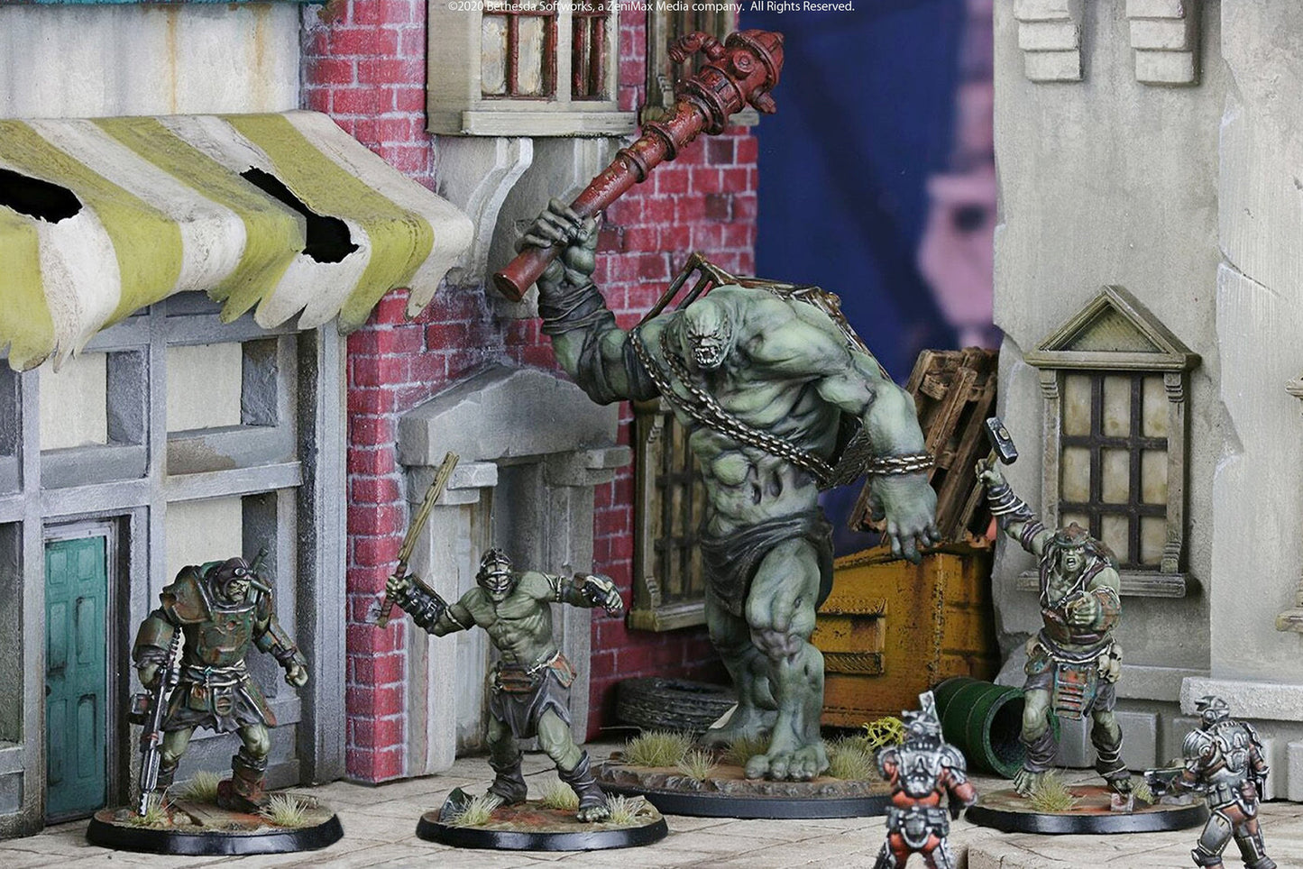 Miniature diorama: A giant green mutant raises a fire hydrant club, surrounded by other mutants in a destroyed city street.