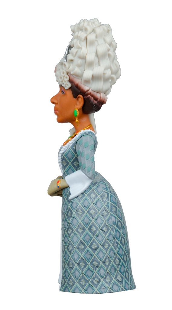 Side view of a MINIX Bridgerton Queen Charlotte Figure with dark skin, a tall white wig, green earrings, a gold necklace, and a patterned blue and green dress
