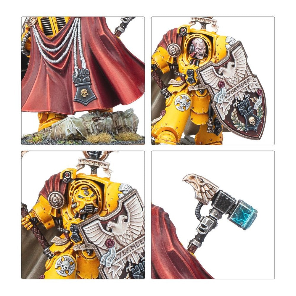 Detailed close-up of a painted Imperial Fists Captain Lysander miniature with shield, yellow armor, and red cloak