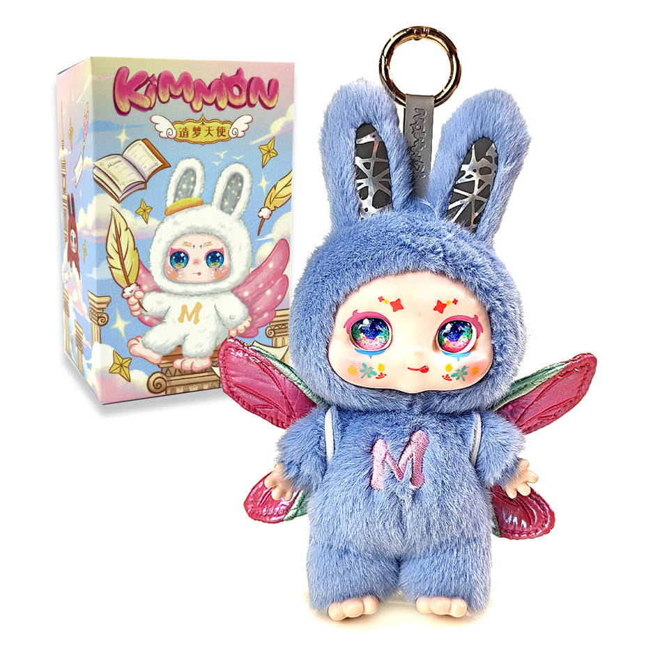 Fuzzy blue Kimmon doll keychain in a rabbit hood with sparkly eyes and pink fairy wings, next to the retail box