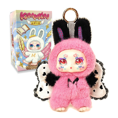 Kimmon pink furry bunny keychain toy with black ears and spotted wings, displayed beside the collectible blind box packaging