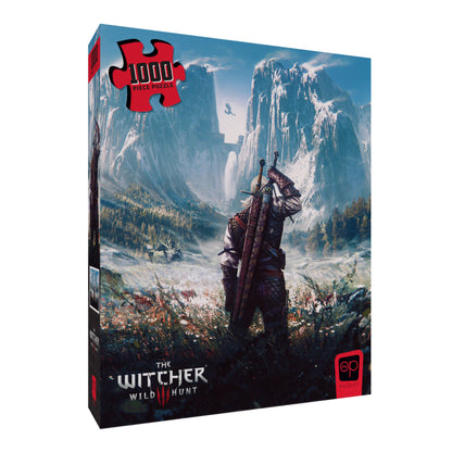 A Witcher Wild Hunt 1000-piece puzzle box showing Geralt, sword on back, viewing a vast, snowy mountain landscape
