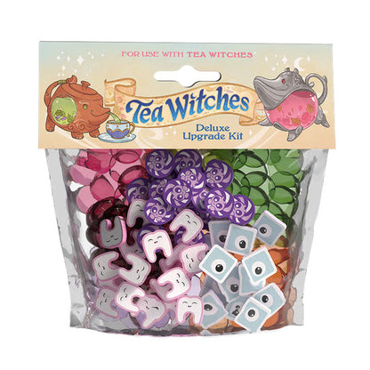 Tea Witches Deluxe Upgrade Kit with tokens shaped like teeth, eyes, and swirls, plus colored translucent gems