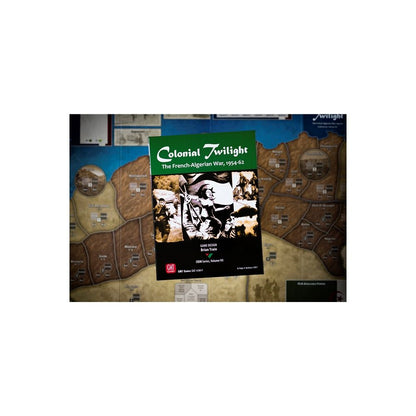 Colonial Twilight: The French-Algerian War, 1954-62 board game box with historical photo collage, set against a detailed game map background