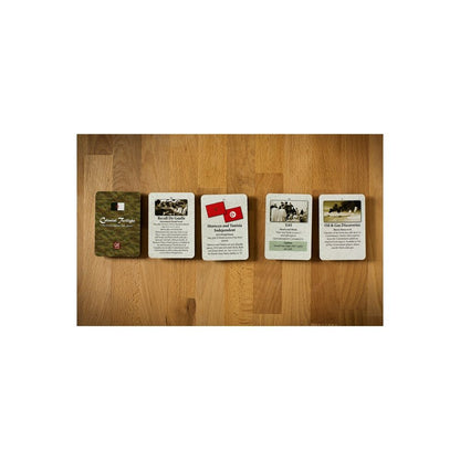 Five Colonial Twilight board game cards laid out on a wooden surface