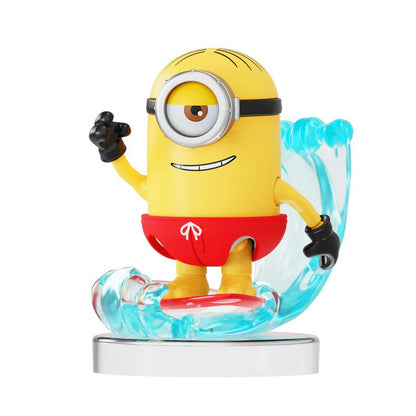 Minion figurine wearing red swim shorts, surfing on a sculpted clear blue wave against a white background