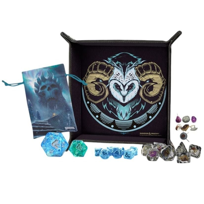 D&D dice tray with owl-ram graphic, dice bag featuring a skull, and assorted blue and clear RPG polyhedral dice sets