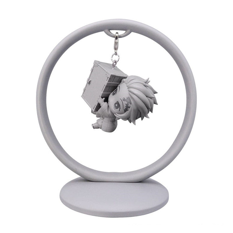 Gray anime character hanging keychain on a circular stand