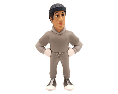 Minix Rocky Balboa vinyl figure in gray hooded sweatsuit with white boxing gloves and black sneakers posed with hands on hips