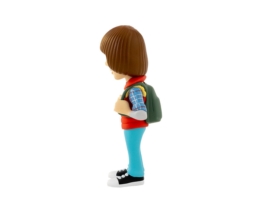 Rear view showing backpack straps and layered clothing texture