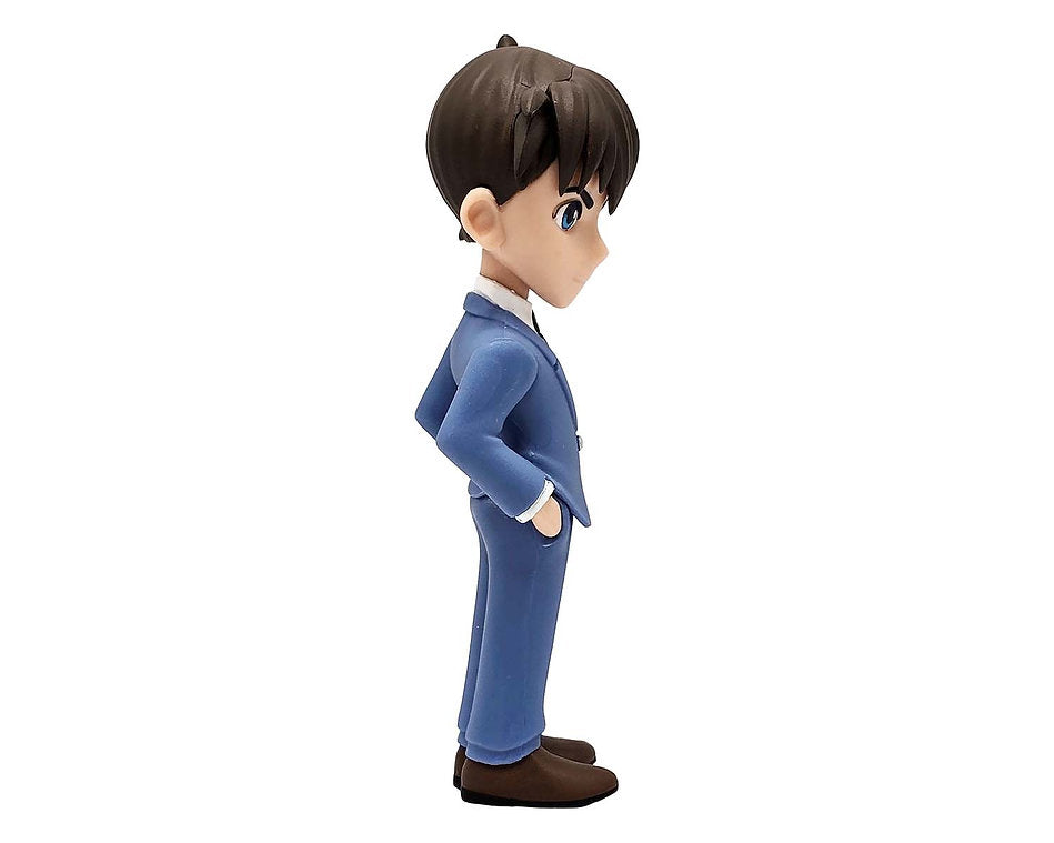 Side view of Minix Detective Conan Jimmy Kudo 115 figurine in a blue suit green tie and brown shoes with hands in pockets