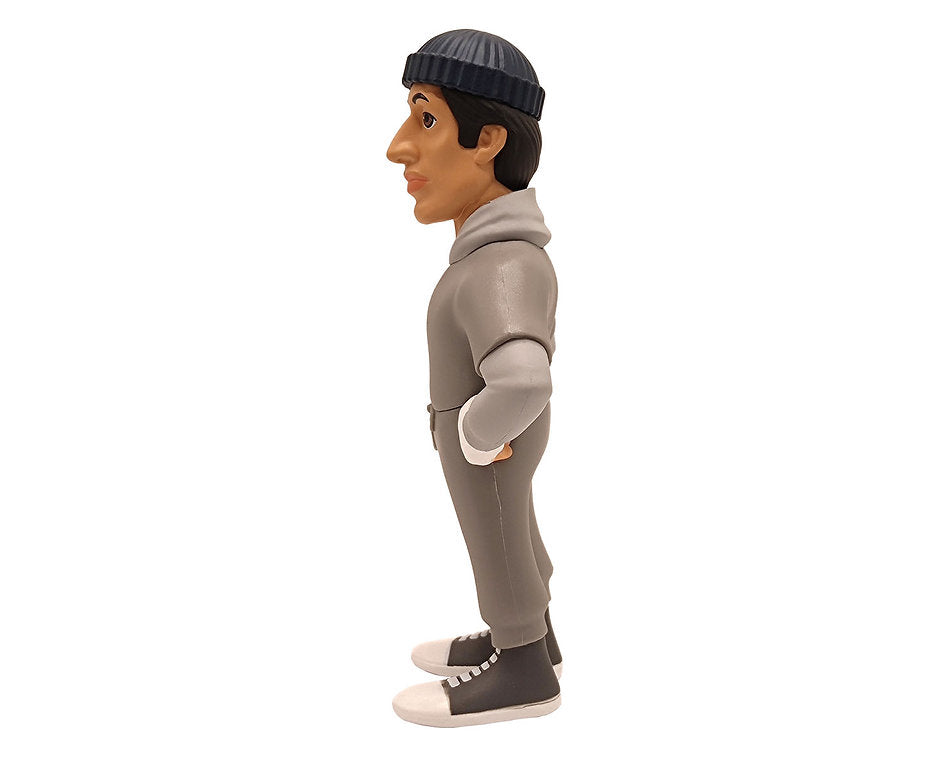 Minix Rocky Balboa collectible vinyl figure in gray hooded tracksuit and black high-top sneakers viewed from the side