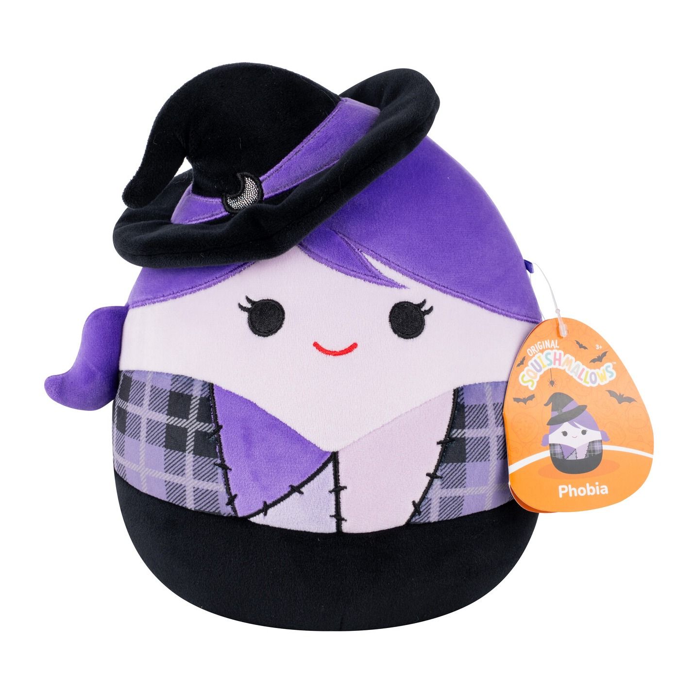 A plush witch Squishmallow with purple hair, a black hat, a light purple face with a red smile, and a plaid and purple body