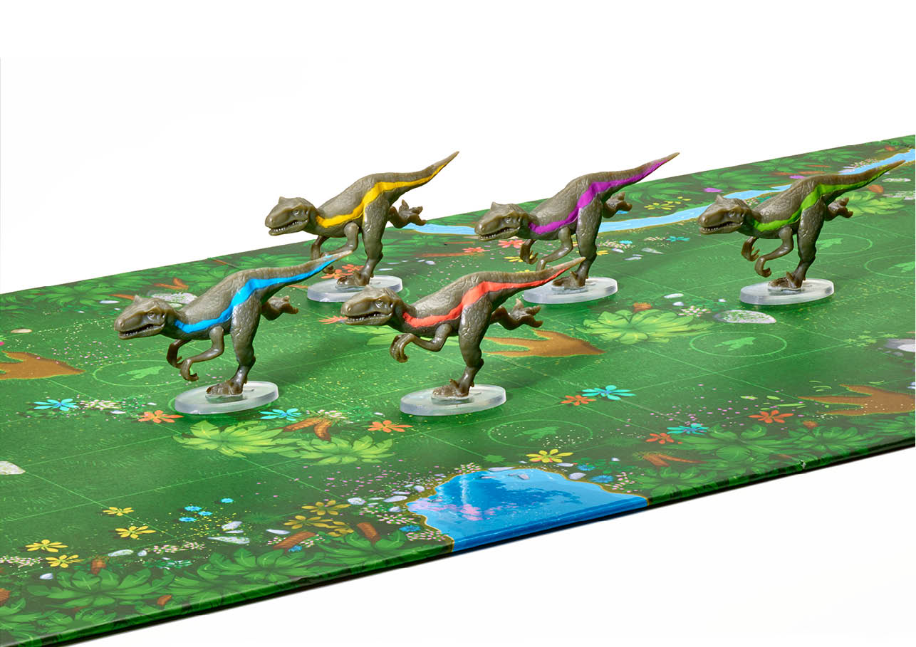 Five green raptor figures with colorful stripes from Raptor Race stand on a green jungle-themed game board