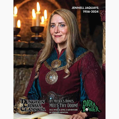 A smiling Jennell Jaquays in a fantasy robe, with candles. Text includes her dates (1956-2024) and game titles