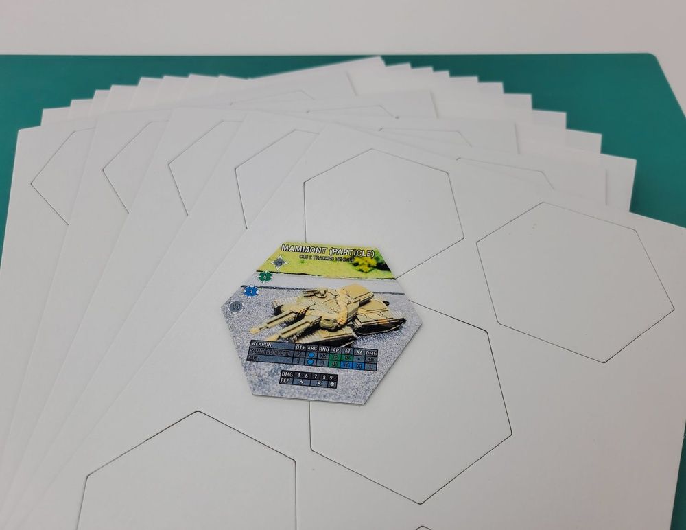 Stack of blank white hexagonal game tokens with one Mammon Particle tank unit game piece showing weapon and damage stats