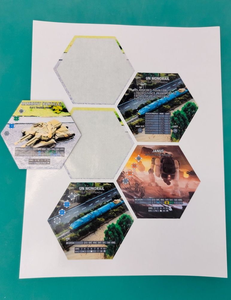 Wargame tokens for UN Monorail and Janus vehicles plus a Mammont Particle combat unit featuring detailed sci-fi designs and game stats