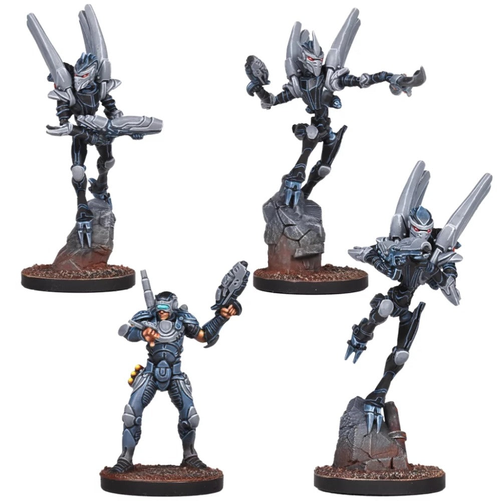 Four painted sci-fi miniatures: three dark, winged alien figures dynamically posed with guns, and one human in blue armor holding a gun