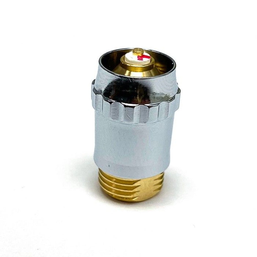 Chrome and brass valve part with a threaded base, topped by a white cap with a red stripe