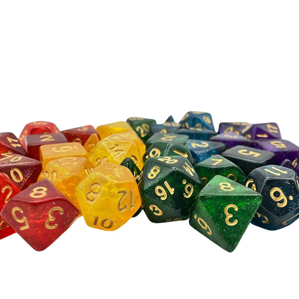 Glitter rainbow polyhedral RPG dice pile (D20, D12, D8), including red, yellow, green, blue, and purple with gold numbers