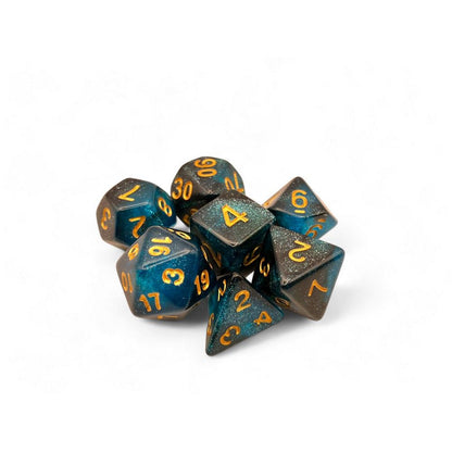 Glittering dark blue polyhedral dice set (7 pieces) with gold numbers