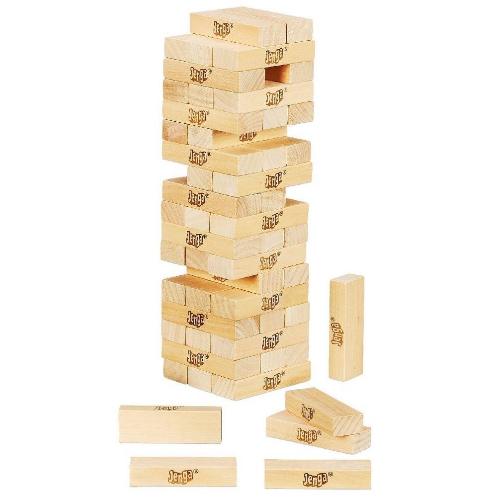 A tall Jenga tower made of light wood blocks, some removed, with additional blocks at its base